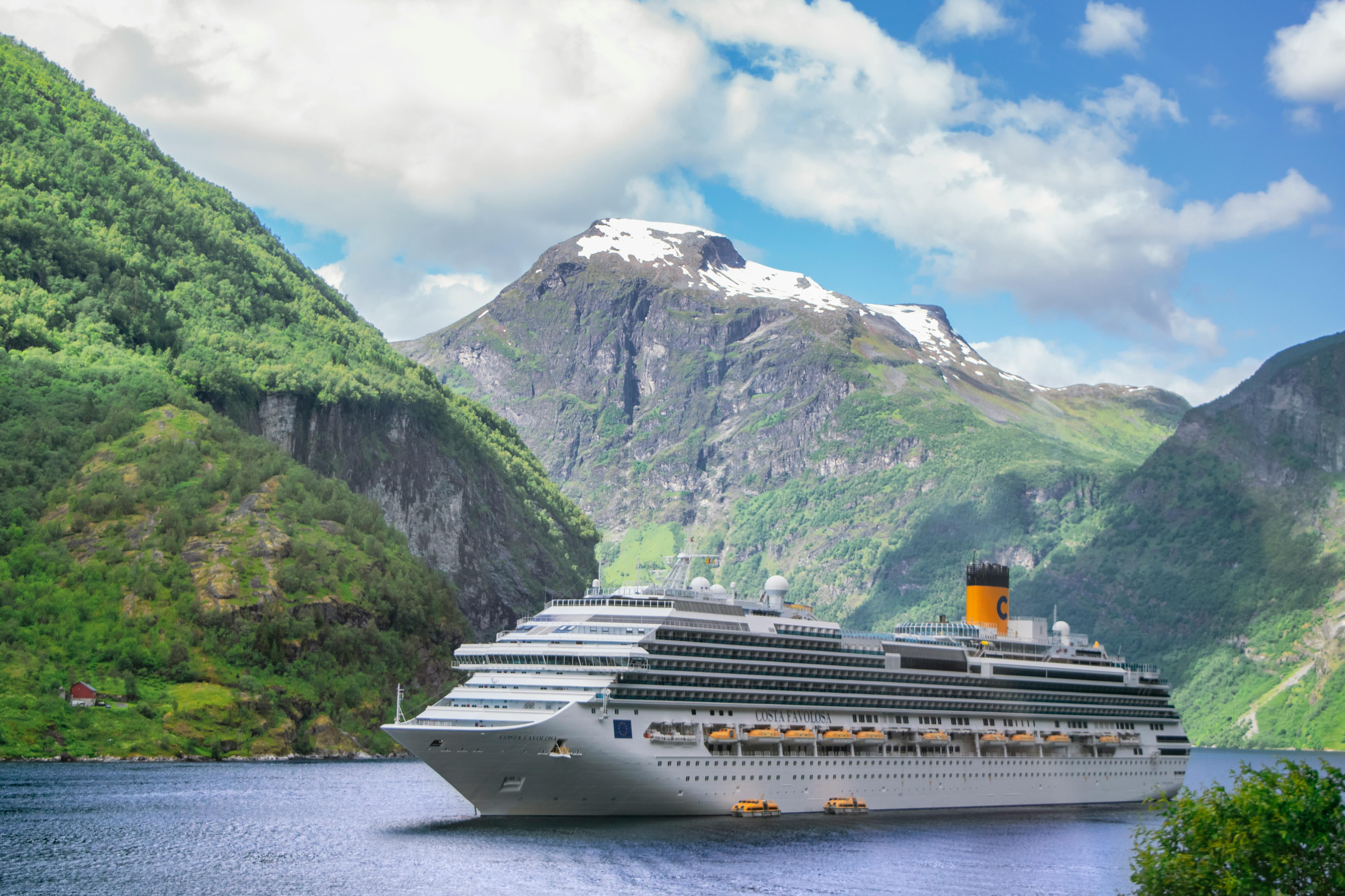 A cruise ship sailing through breathtaking Norwegian fjords
