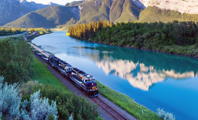 A train winding through the scenic Canadian Rocky Mountains